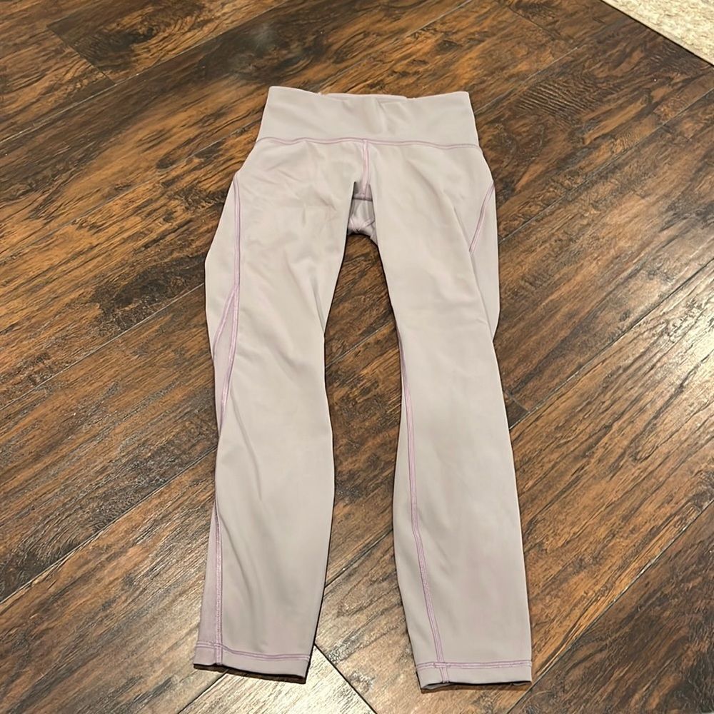 Lululemon size 4 leggings Greyish purple with mesh on the side GUC